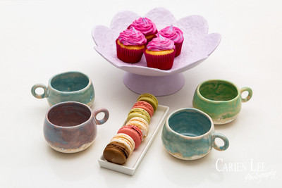 Commercial product photography highlighting handcrafted pottery in natural tones.