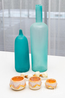 Commercial product photography highlighting handcrafted pottery in natural tones.