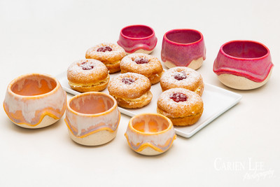 Commercial product photography highlighting handcrafted pottery in natural tones.