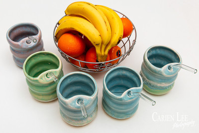Commercial product photography highlighting handcrafted pottery in natural tones.
