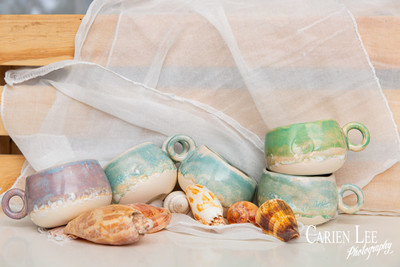 Commercial product photography highlighting handcrafted pottery in natural tones.