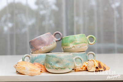 Commercial product photography highlighting handcrafted pottery in natural tones.