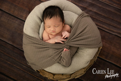Newborn photography Bunbury – sleeping baby curled up on a soft blanket