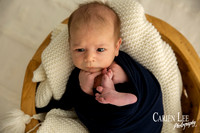 Newborn baby Luca sleeping in wrap, Bunbury newborn photography