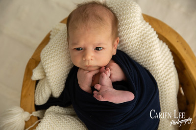 Newborn baby Luca sleeping in wrap, Bunbury newborn photography