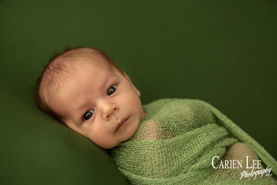 Newborn baby Luca sleeping in wrap, Bunbury newborn photography