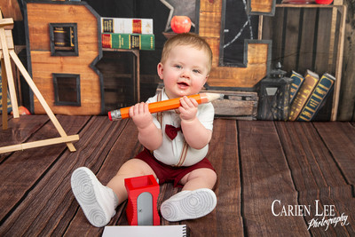 Close-up of baby Kai's curious expression during his 8 month milestone photoshoot