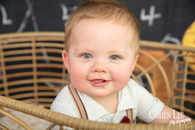 Kai concentrating on a toy during his 8 month personality-focused photoshoot
