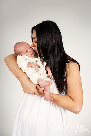 bunbury mother kissing newborn baby