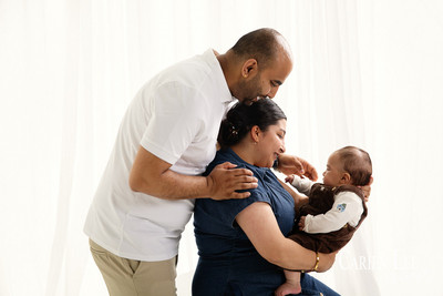Baby making eye contact with grandparents during Bunbury family photo session