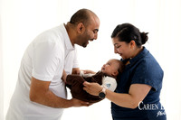 Baby boy reaching and interacting during natural family photography session