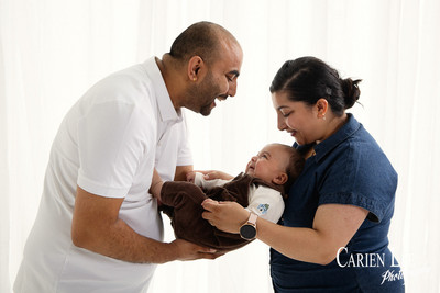 Baby boy reaching and interacting during natural family photography session