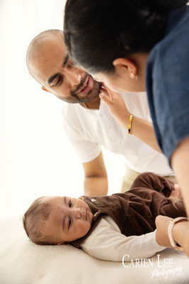 Close-up of 4 month old baby's genuine smile during milestone photography session