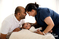 Parents laughing with baby during relaxed family portrait session in Bunbur