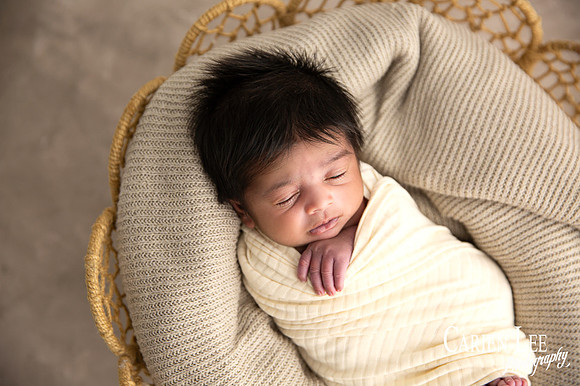 Newborn baby Isaiah wrapped in soft blanket during Bunbury newborn photography session