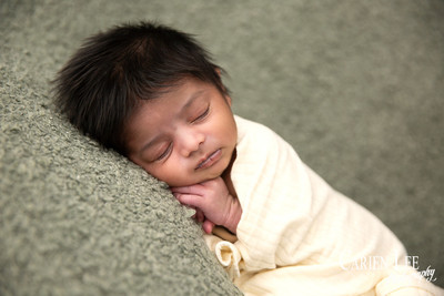 Newborn baby Isaiah wrapped in soft blanket during Bunbury newborn photography session