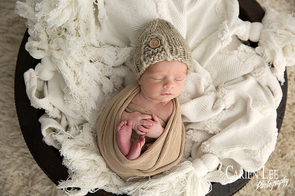 Newborn baby's peaceful sleeping face during professional Bunbury photo session