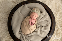 Tiny sleeping newborn baby posed on soft blanket, Bunbury newborn photography