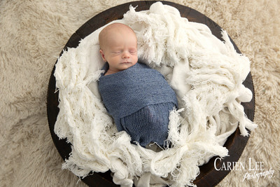 Baby Noah sleeping soundly wrapped in soft wrap, Bunbury newborn photoshoot