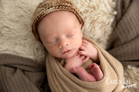 Close-up of newborn baby's delicate eyelashes and sleepy expression, Bunbury