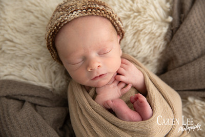 Close-up of newborn baby's delicate eyelashes and sleepy expression, Bunbury