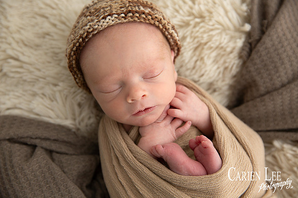 Close-up of newborn baby's delicate eyelashes and sleepy expression, Bunbury