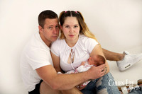 newborn baby girl and parent during a newborn shoot
