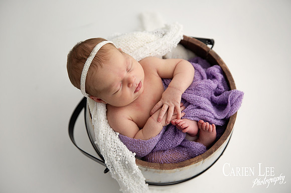 newborn girl in bucket during a newborn session in Bunbury