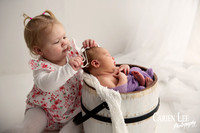 Sibling love during a newborn session in Bunbury