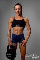Female fitness portrait standing in sportswear against a grey studio backdrop in Bunbury.