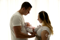 Parents with their newborn girl during newborn photo session in Bunbury