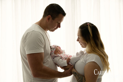 Parents with their newborn girl during newborn photo session in Bunbury
