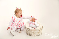 sibling photo of 2 little girls during a newborn session in bunbury