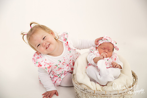 cute older sibling love during a newborn session in Bunbury
