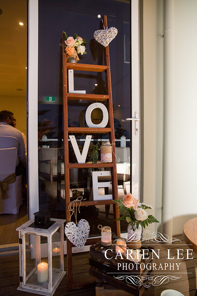 Bride and groom cutting the cake at busselton wedding