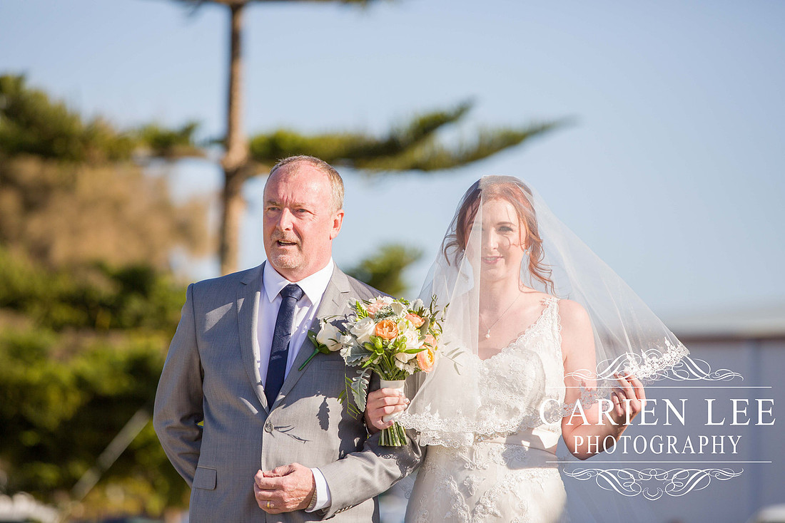 Bride arriving at beach wedding at Busselton Jetty