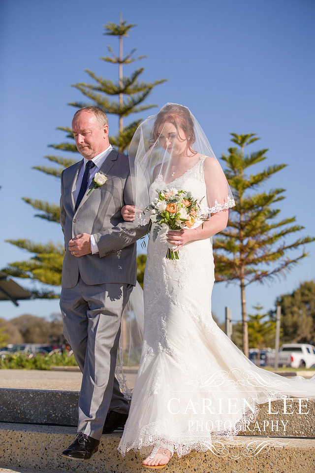 Bride arriving at beach wedding at Busselton Jetty