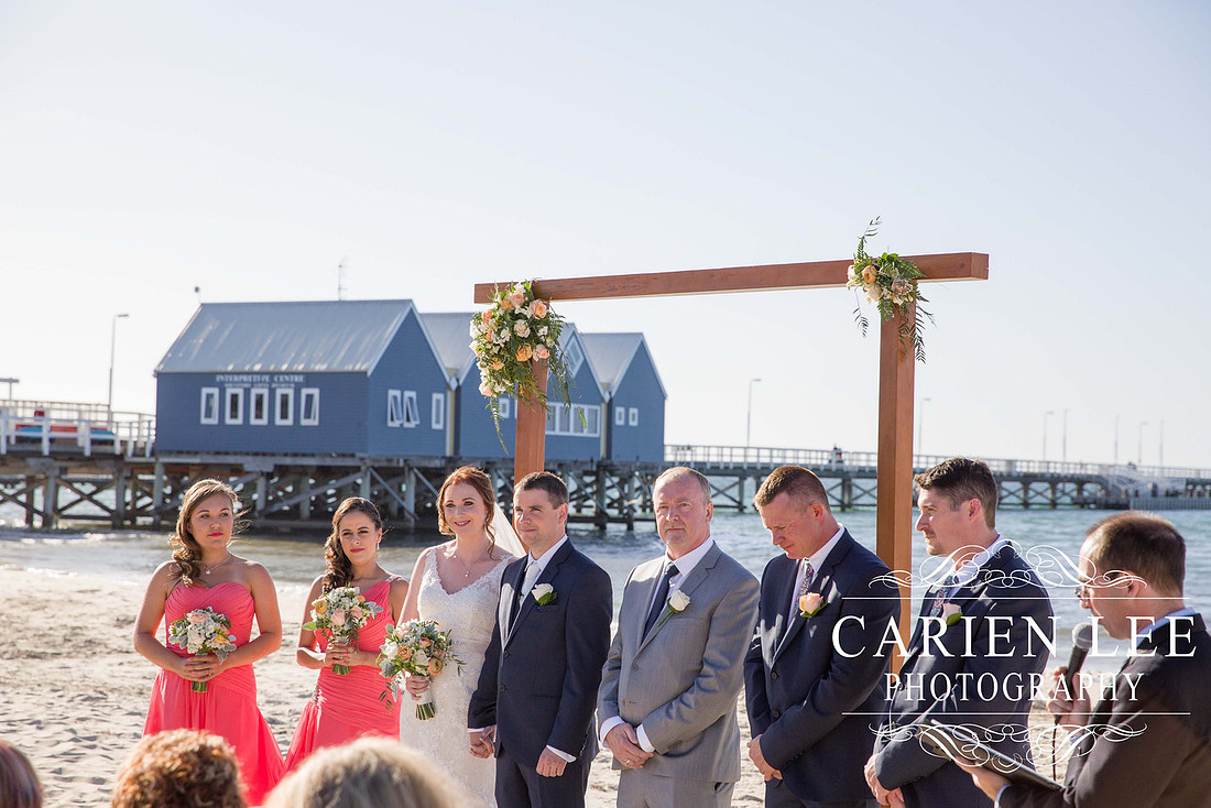Bridal party in front of the Busselton Jetty on a busselton beach wedding