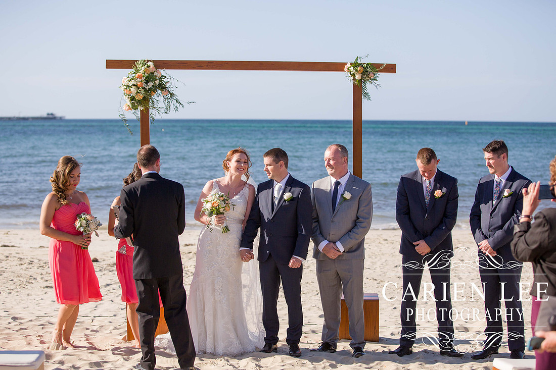 Bridal party in front of the Busselton Jetty on a busselton beach wedding