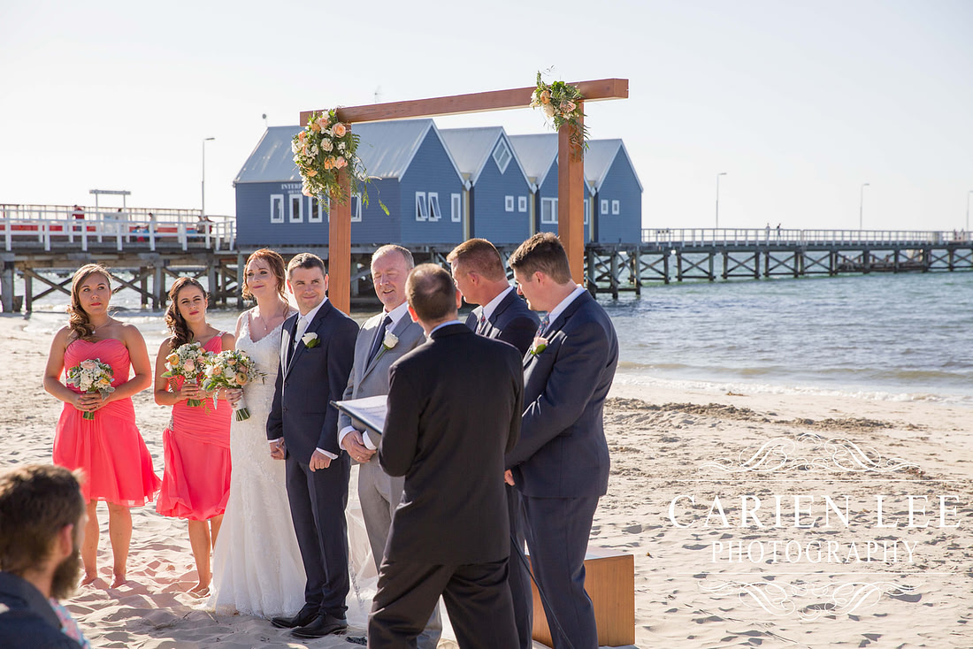 Bridal party in front of the Busselton Jetty on a busselton beach wedding