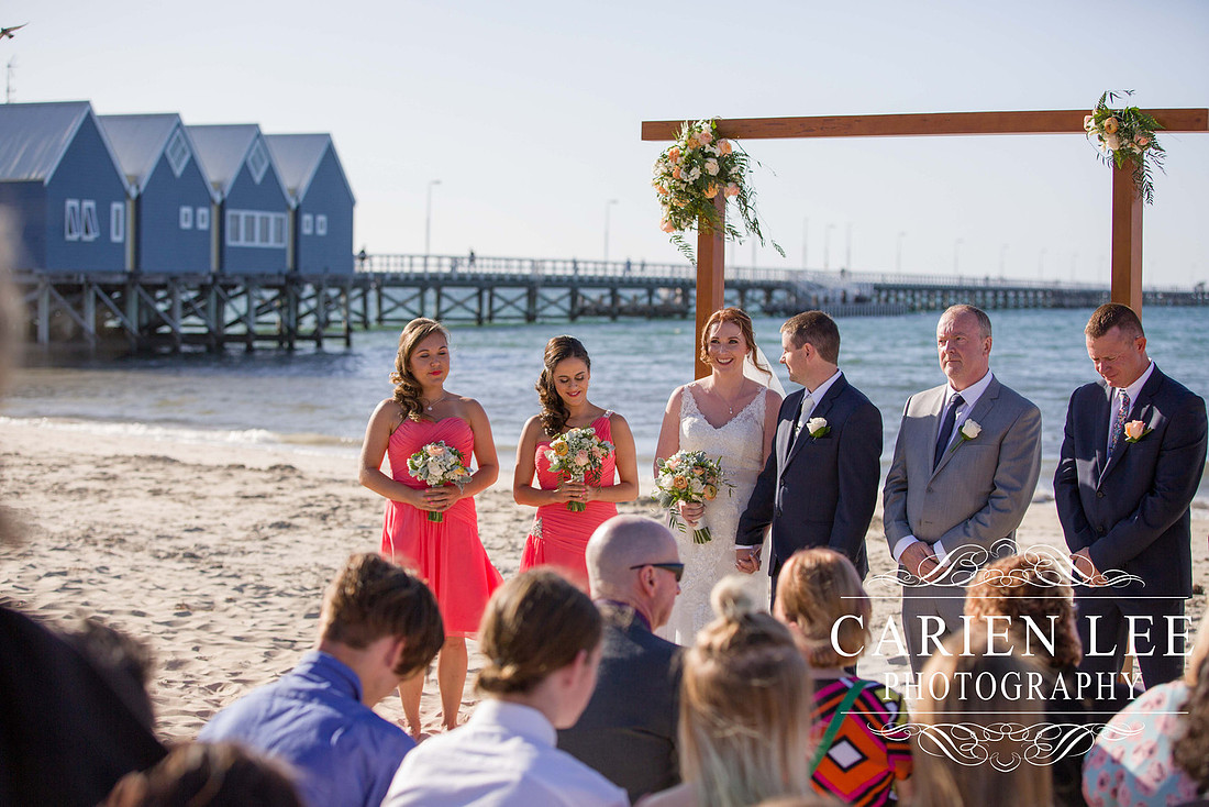 Bridal party in front of the Busselton Jetty on a busselton beach wedding