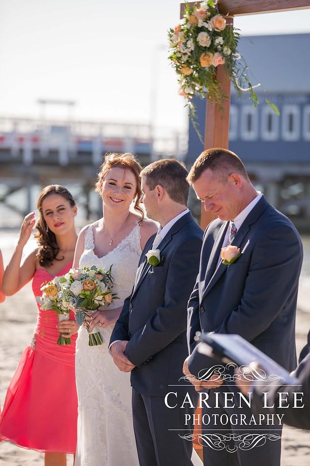 Newly wed couple on the beach in busselton in front of the Busselton Jetty