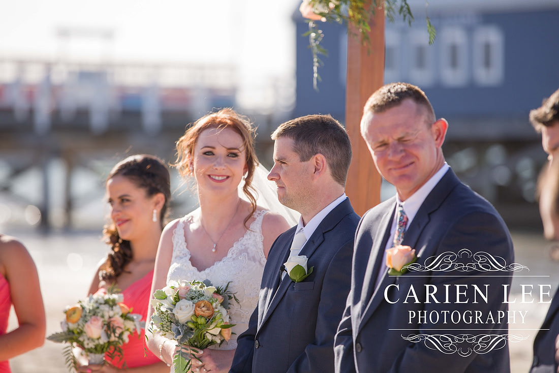 Newly wed couple on the beach in busselton in front of the Busselton Jetty