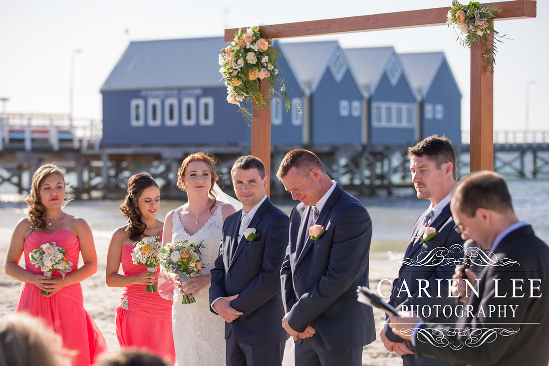 Newly wed couple on the beach in busselton in front of the Busselton Jetty