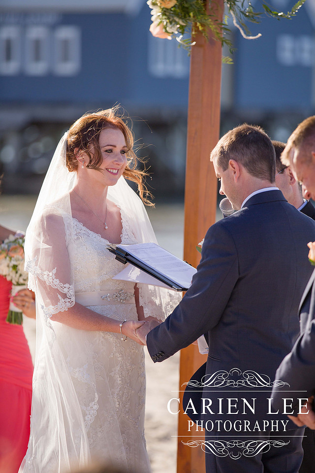 Bride and groom saying vowels at busselton beach wedding ceremony