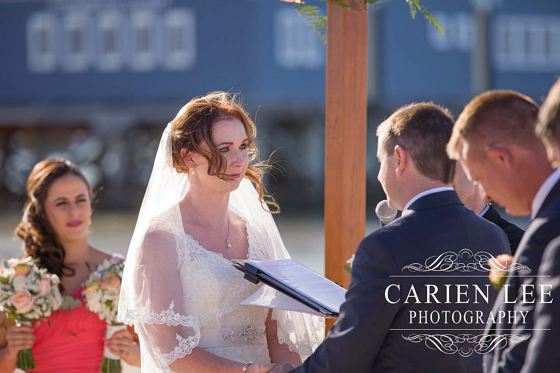Bride and groom saying vowels at busselton beach wedding ceremony