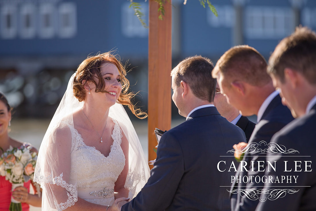 Bride and groom saying vowels at busselton beach wedding ceremony