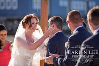 Bride and groom saying vowels at busselton beach wedding ceremony