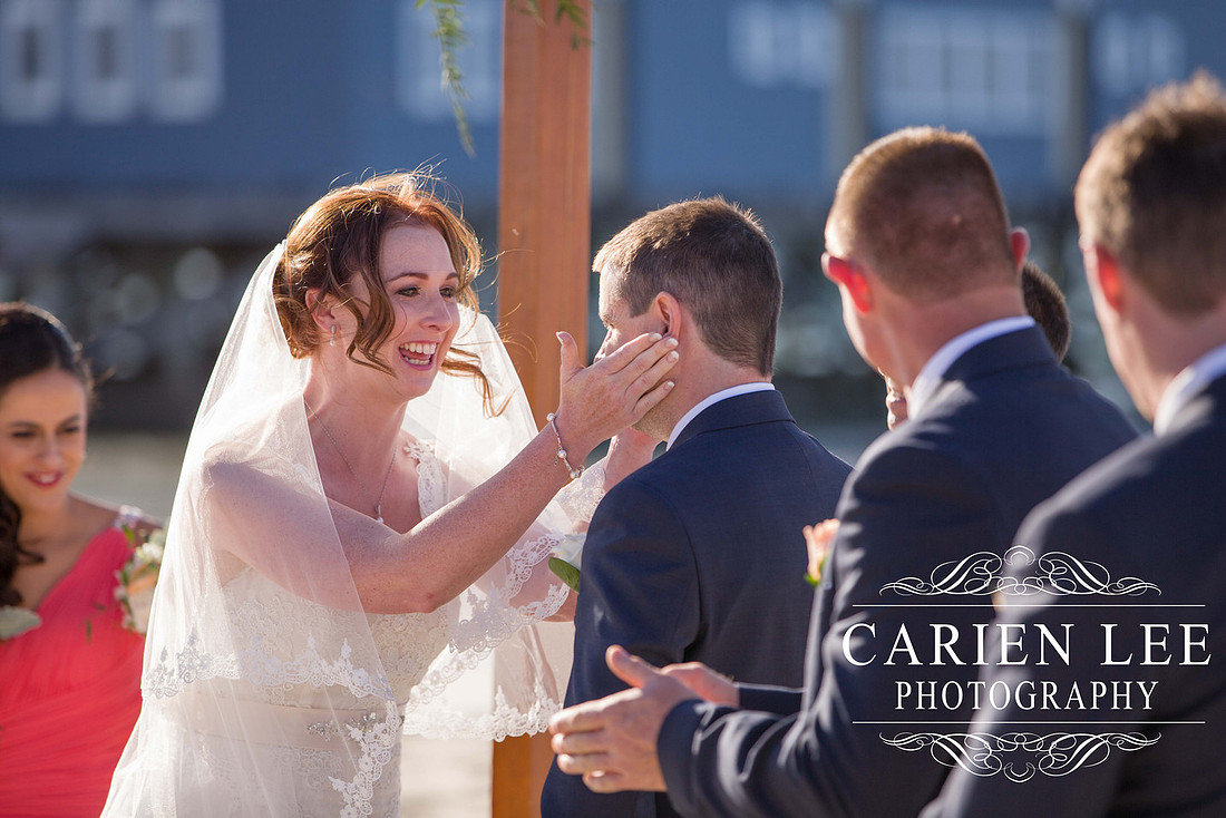 Bride and groom saying vowels at busselton beach wedding ceremony