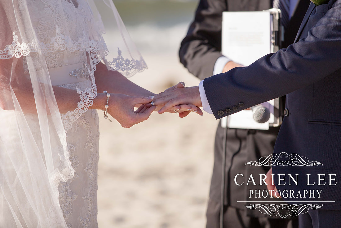 Bride and groom exchanging rings at busselton beach wedding ceremony